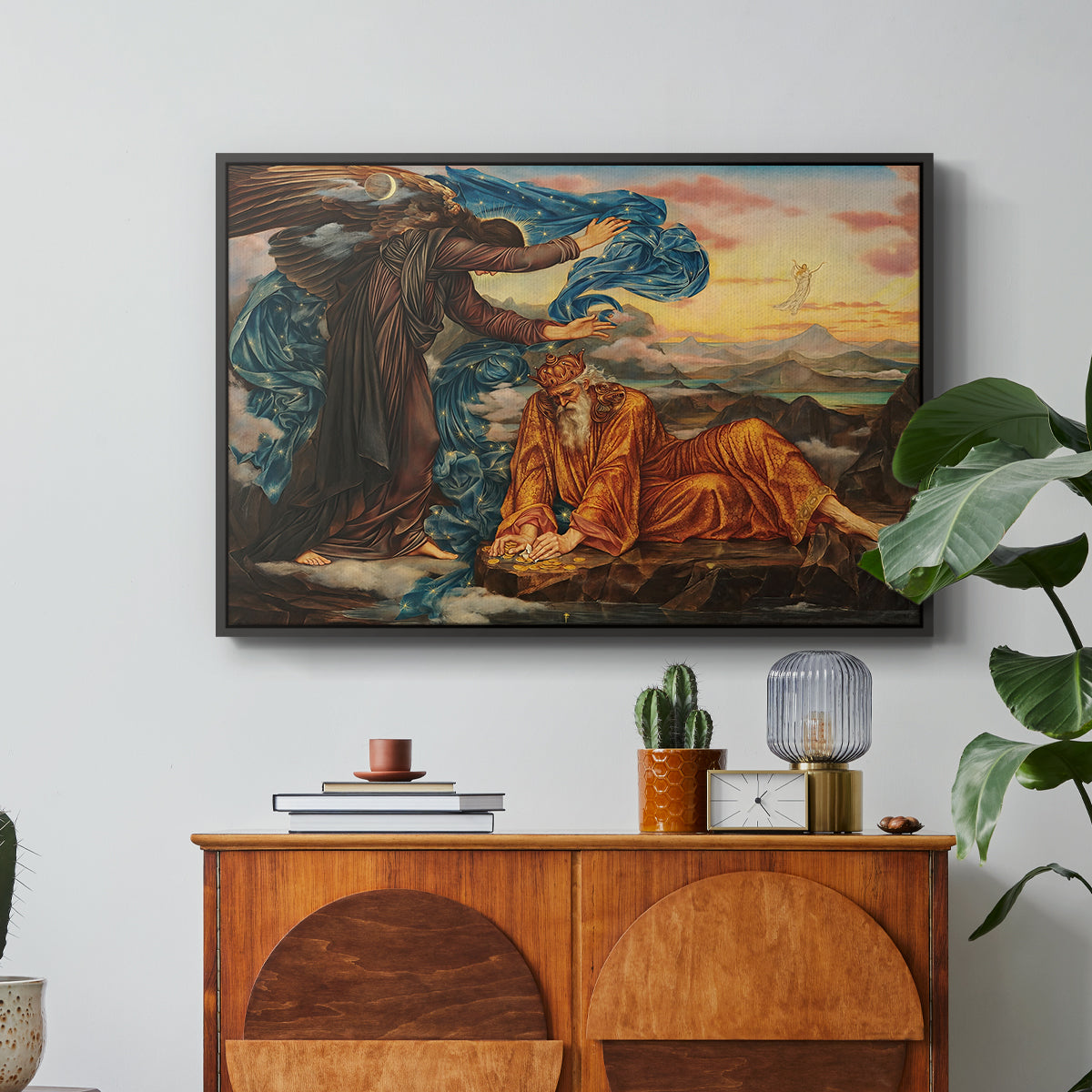 Earthbound, 1897 by Evelyn De Morgan in a black floater framed canvas featuring a reclining female figure surrounded by symbolic elements in dreamlike setting, displayed above a wood console cabinet.