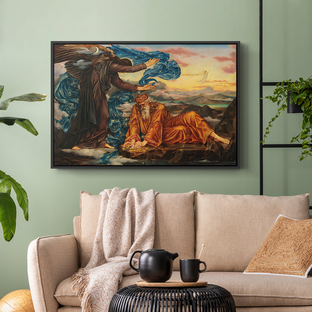 Black floater framed canvas featuring a classical-style figure lying in ornate, mystical environment, displayed above a sofa in a modern living room.