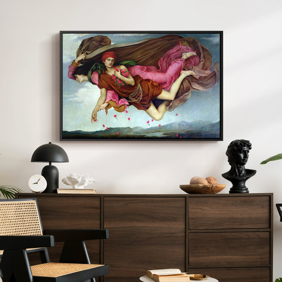 Night and Sleep, 1878 by Evelyn De Morgan displayed in a black floater framed canvas above a dark wood credenza in an entryway.