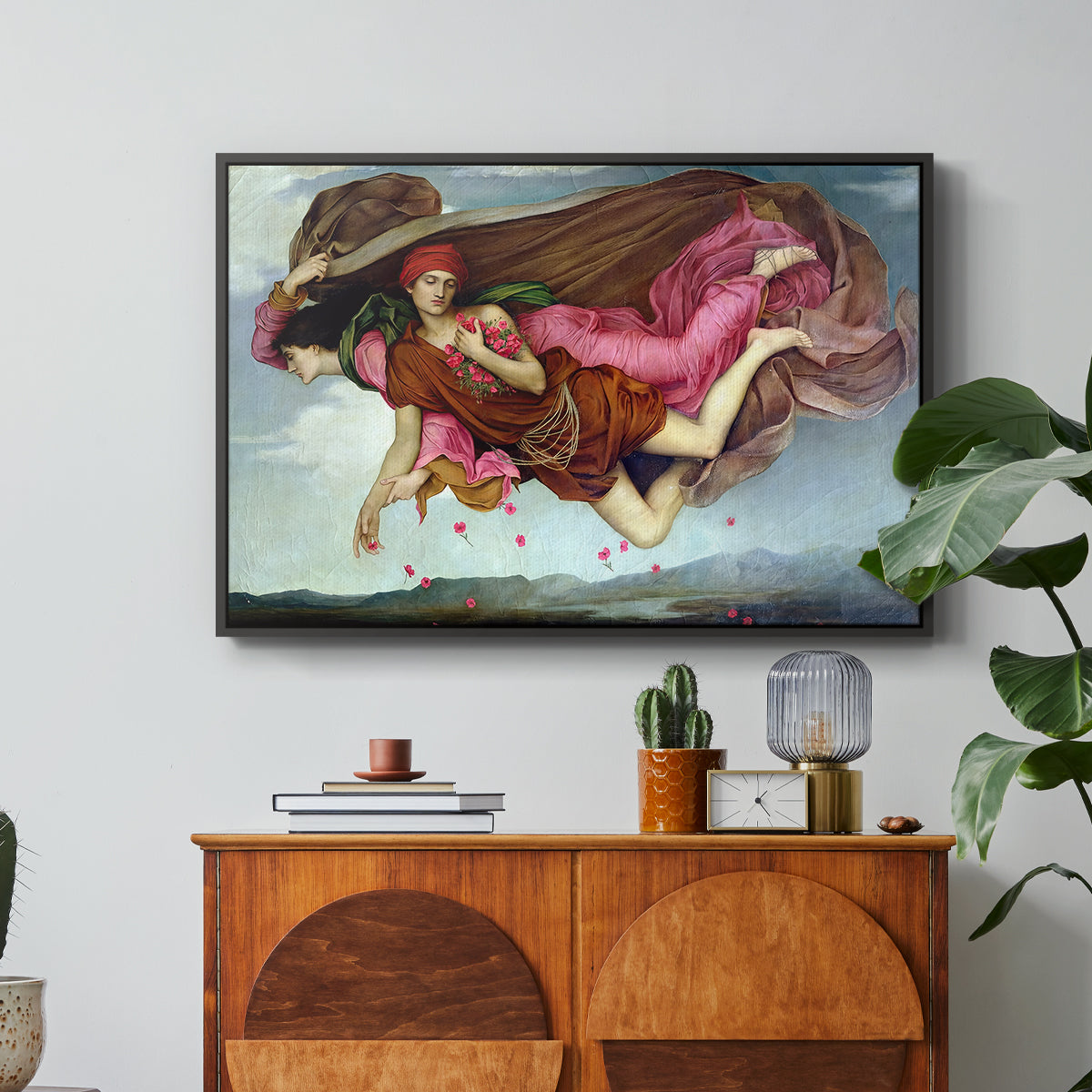 Night and Sleep, 1878 by Evelyn De Morgan in a black floater framed canvas featuring two intertwined female figures floating through dark sky representing night and sleep, displayed above a wood console cabinet.