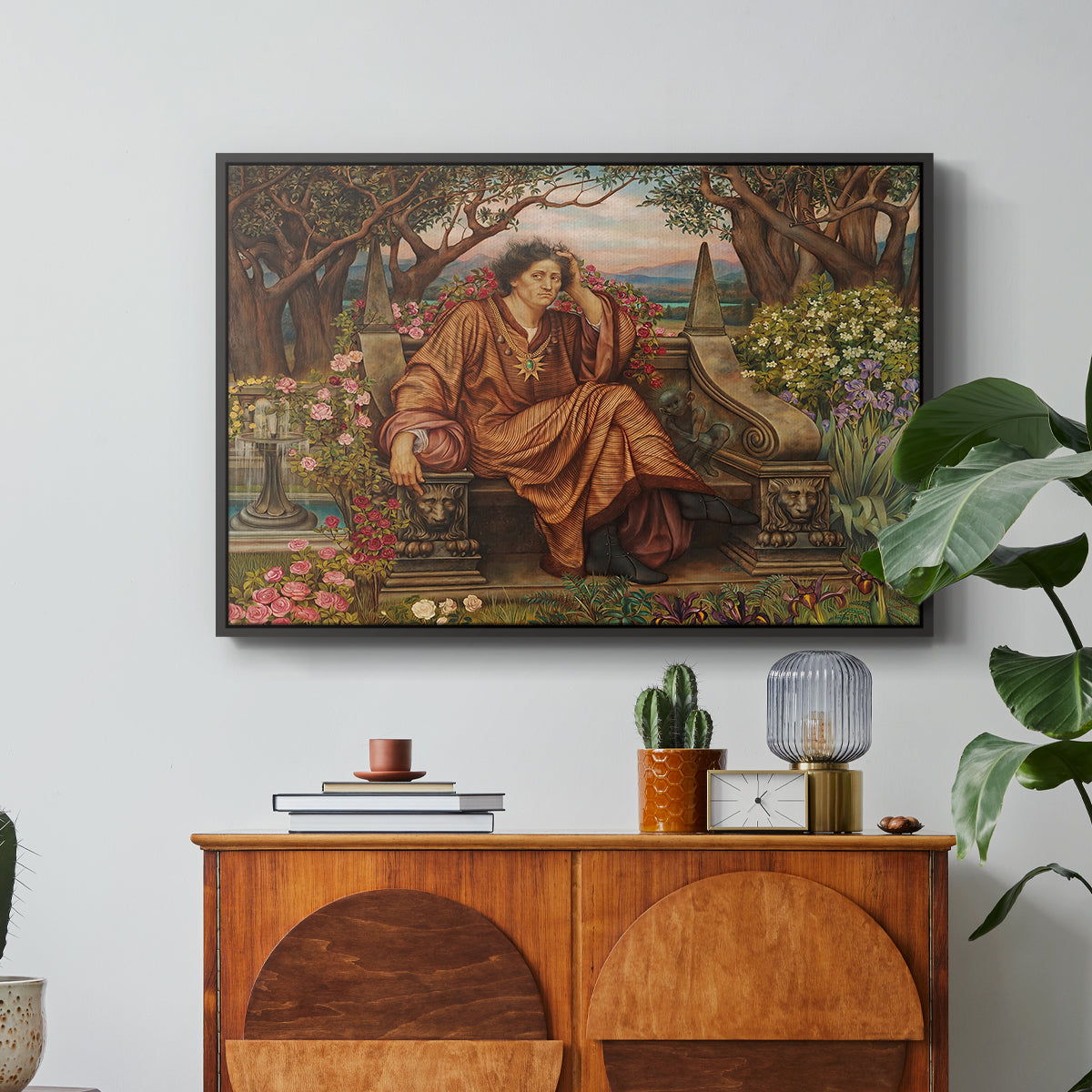 A Soul in Hell, c. 1901-1902 by Evelyn De Morgan in a black floater framed canvas featuring a distressed figure surrounded by flames and torment in symbolic hell scene, displayed above a wood console cabinet.