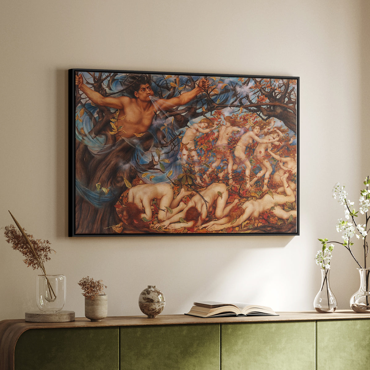 Black floater framed canvas of Boreas and the Fallen Leaves, c. 1910-1914 by Evelyn De Morgan, featuring a mythological scene of wind god Boreas moving through autumn leaves above a sideboard in a softly lit hallway.