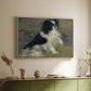 White floater framed canvas of Tama, the Japanese Dog, c. 1876 by Pierre-Auguste Renoir, featuring an impressionist painting of a dog wading through water with blurred background above a sideboard in a softly lit hallway.