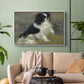 White floater framed canvas featuring an animal portrait of a dog in natural outdoor setting with soft light, displayed above a sofa in a modern living room.
