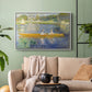 White floater framed canvas featuring a leisure scene of figures in a small rowboat on tranquil water, displayed above a sofa in a modern living room.