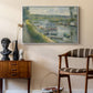 Wash-House Boat at Bas-Meudon, c. 1874 by Pierre-Auguste Renoir as a white floater framed canvas featuring an impressionist depiction of working boat along calm waterway, styled above a mid-century console in a contemporary living area.