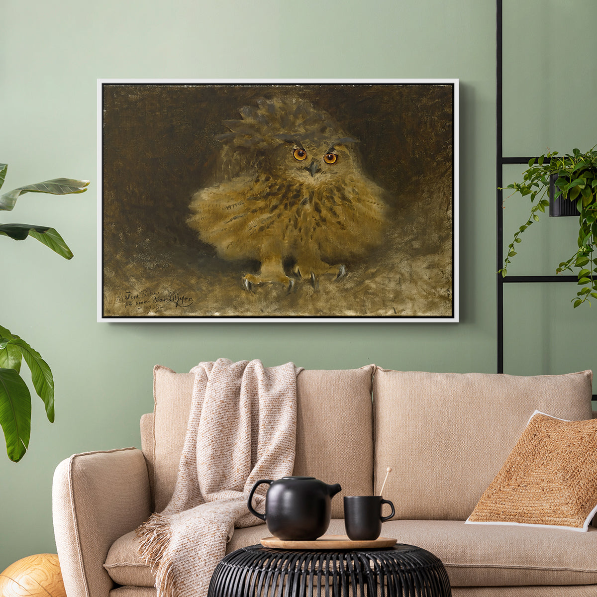 White floater framed canvas featuring a realistic depiction of owl camouflaged within woodland environment, displayed above a sofa in a modern living room.