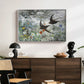 Common Swifts, 1886 by Bruno Liljefors displayed in a white floater framed canvas above a dark wood credenza in an entryway.