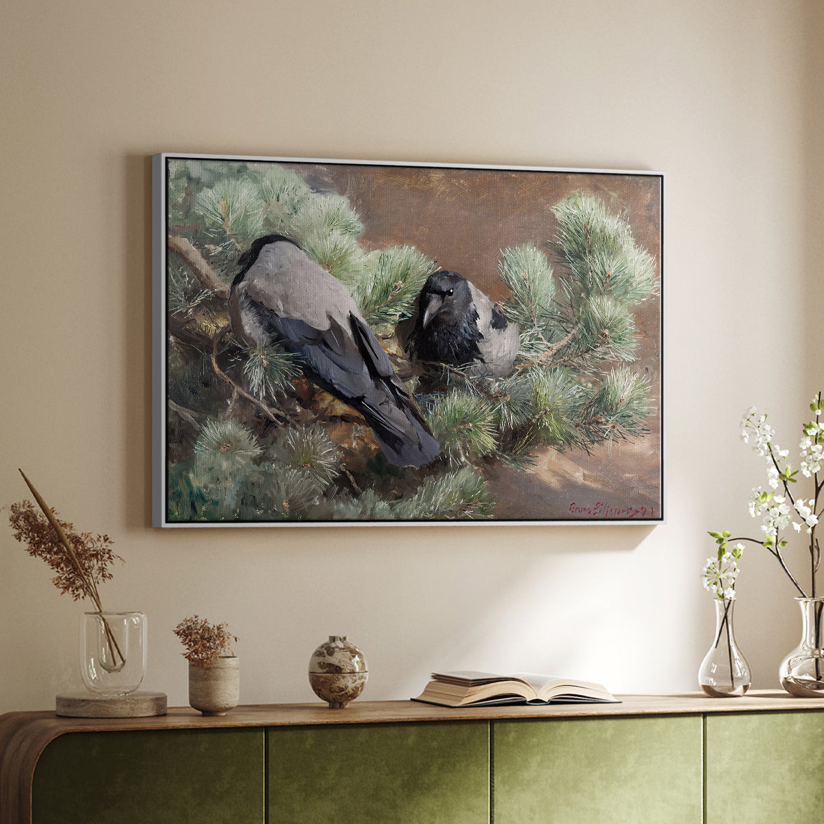 White floater framed canvas of Hooded Crows (Kråkor), 1891 by Bruno Liljefors, featuring birds standing alert in natural field environment above a sideboard in a softly lit hallway.