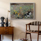 Cat on a Flowery Meadow, 1887 by Bruno Liljefors as a white floater framed canvas featuring an animal scene of cat hidden in lush meadow vegetation, styled above a mid-century console in a contemporary living area.