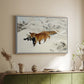White floater framed canvas of Fox in Snow Landscape, 1900 by Bruno Liljefors, featuring a wildlife scene of fox moving swiftly through winter terrain above a sideboard in a softly lit hallway.