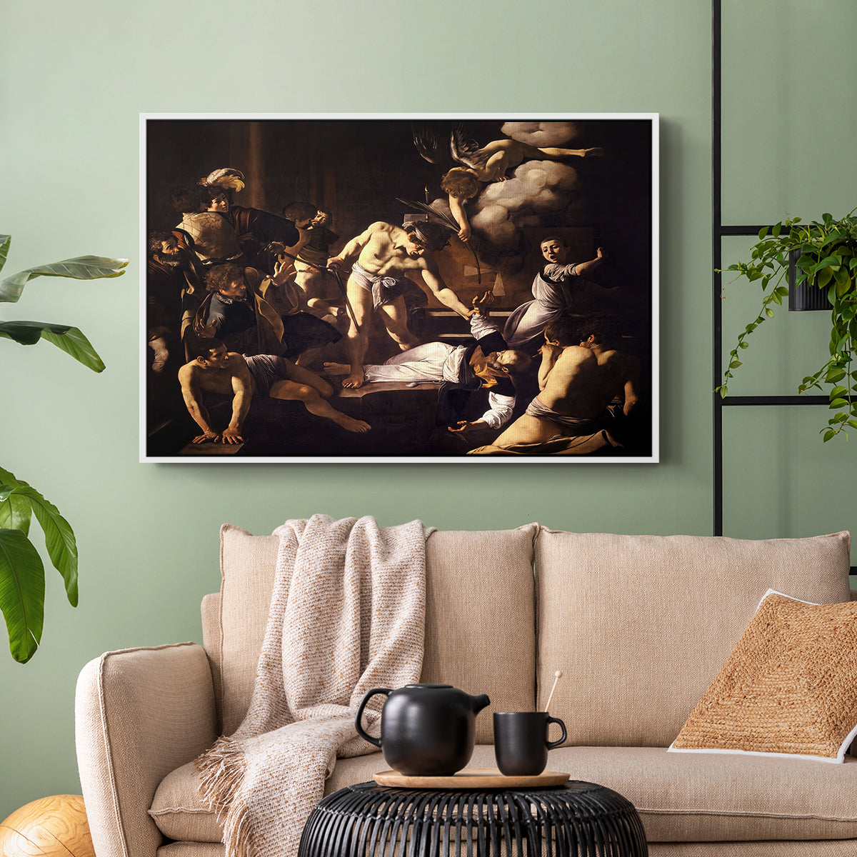 White floater framed canvas featuring a Baroque composition of movement and emotion during martyrdom, displayed above a sofa in a modern living room.