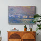 Charing Cross Bridge, 1903 by Claude Monet in a white floater framed canvas featuring an impressionist view of bridge stretching across river with soft light and haze, displayed above a wood console cabinet.