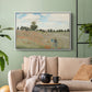 White floater framed canvas featuring a rural landscape with scattered figures among blooming flowers, displayed above a sofa in a modern living room.