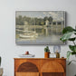 The Bridge at Argenteuil, 1874 by Claude Monet in a white floater framed canvas featuring a bridge spanning river with sailboats and reflections in water, displayed above a wood console cabinet.