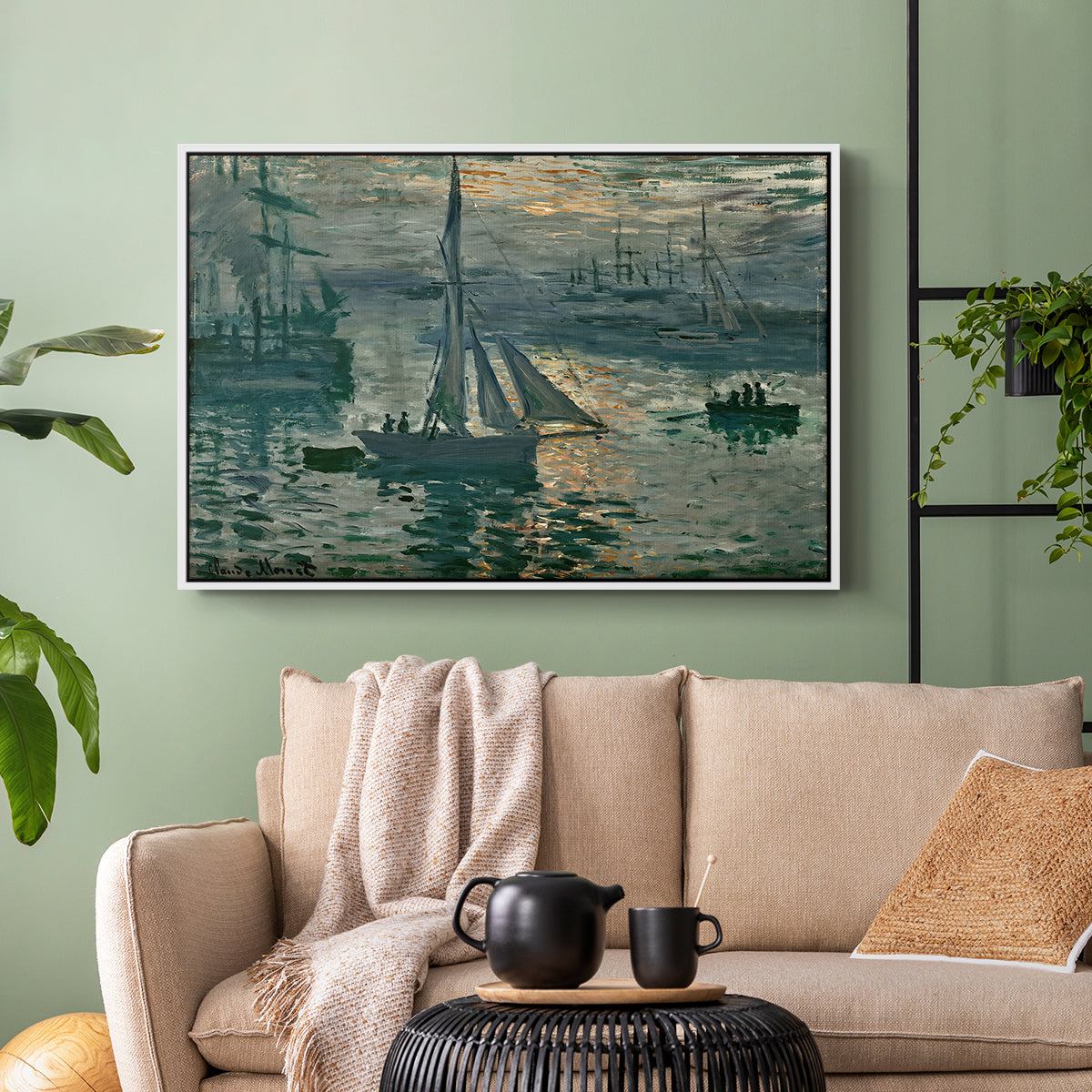 White floater framed canvas featuring an atmospheric ocean view with sun rising through haze, displayed above a sofa in a modern living room.
