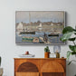The Basin at Argenteuil, 1874 by Claude Monet in a white floater framed canvas featuring sailboats gathered in calm basin with reflections on water, displayed above a wood console cabinet.