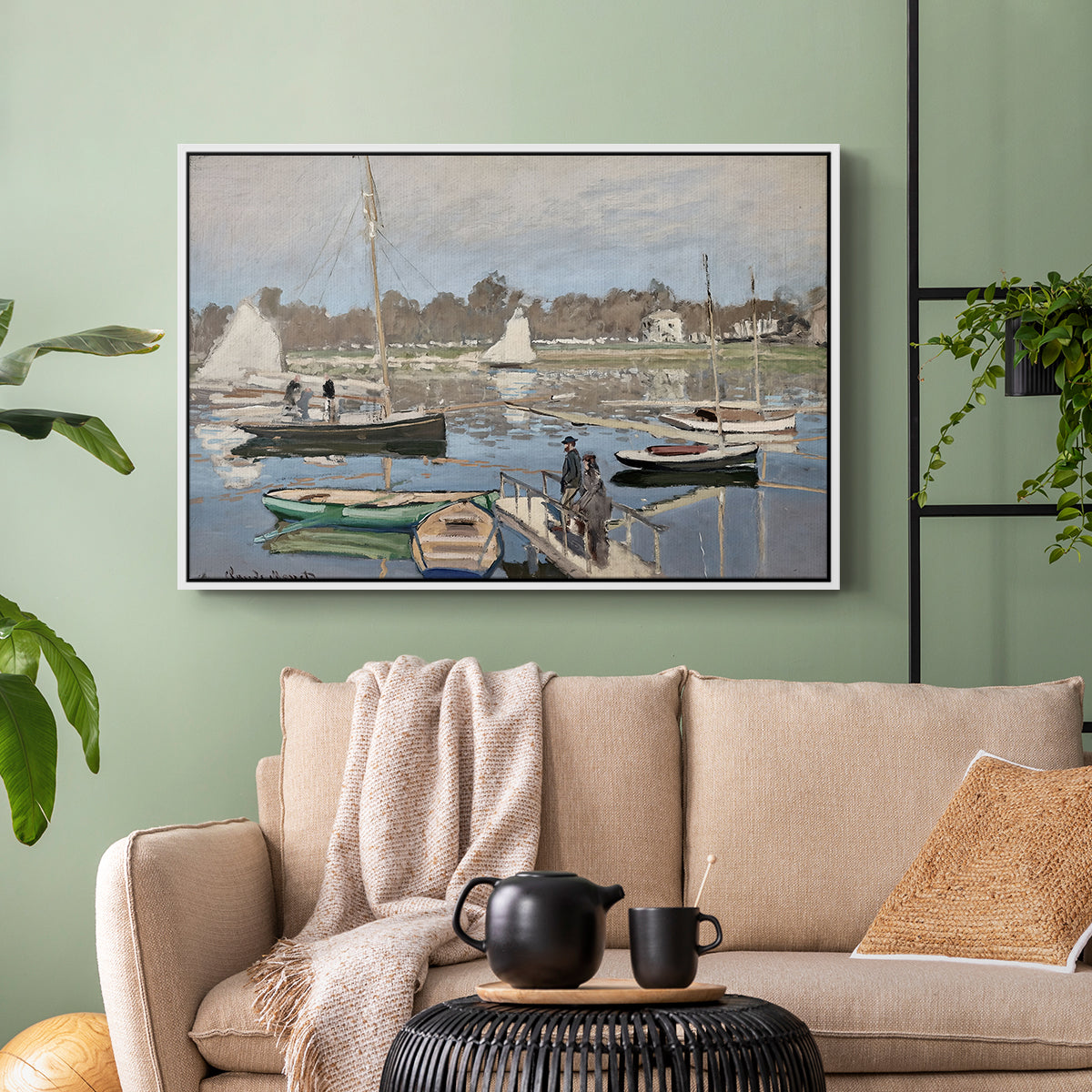 White floater framed canvas featuring a tranquil river setting with sailboats and shoreline, displayed above a sofa in a modern living room.