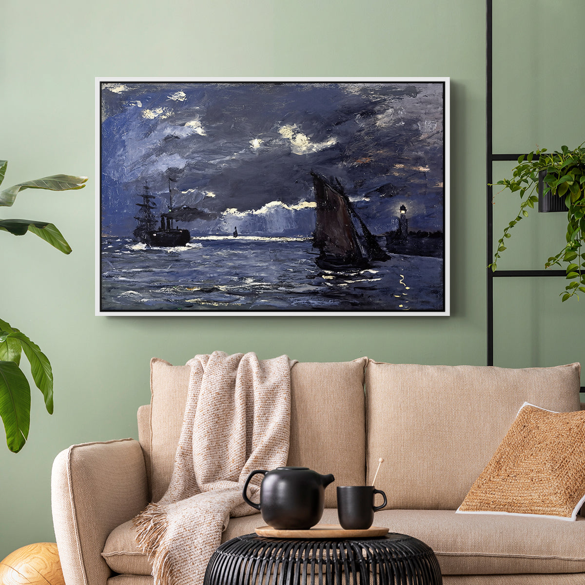White floater framed canvas featuring an atmospheric maritime view with ships in moonlit darkness, displayed above a sofa in a modern living room.