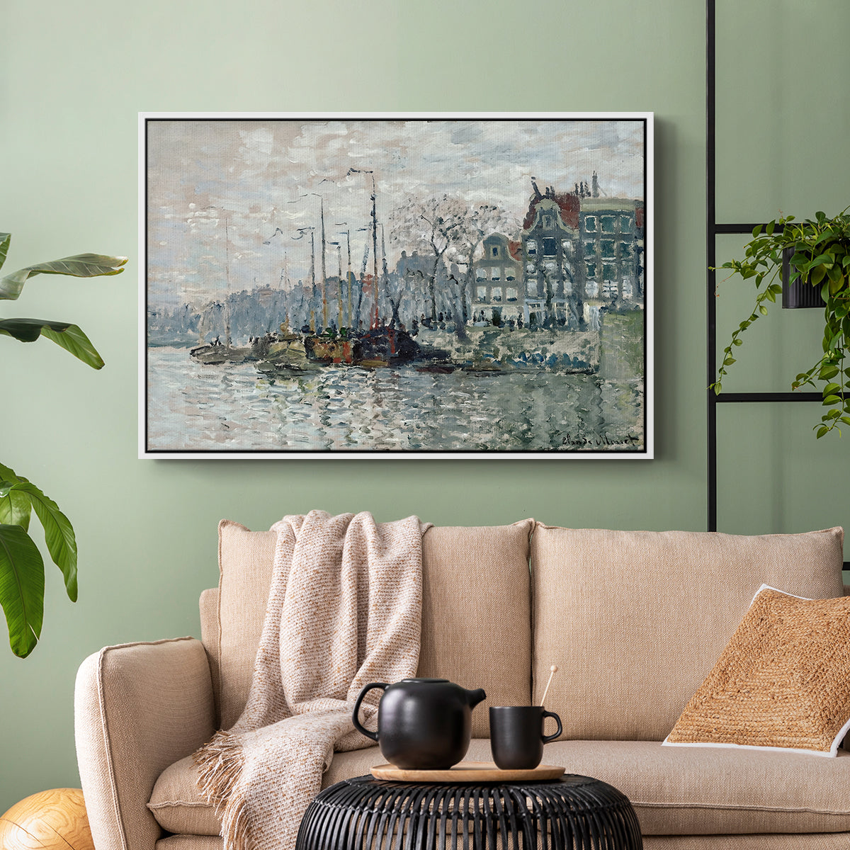 White floater framed canvas featuring a harbor view with masts, houses, and reflections in water, displayed above a sofa in a modern living room.