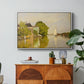 Houses on the Achterzaan, 1871 by Claude Monet in a white floater framed canvas featuring colorful houses reflected in calm river surrounded by greenery, displayed above a wood console cabinet.