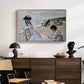 On the Beach at Trouville, 1870 by Claude Monet displayed in a white floater framed canvas above a dark wood credenza in an entryway.
