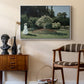 Woman in the Garden, Sainte-Adresse, 1867 by Claude Monet as a white floater framed canvas featuring an elegant woman posed outdoors among blooming plants, styled above a mid-century console in a contemporary living area.
