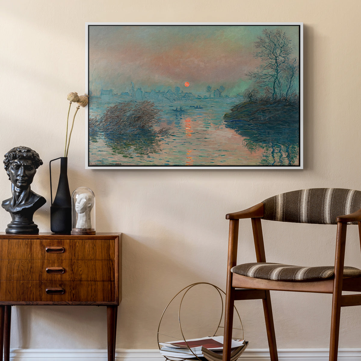 Sunset on the Seine at Lavacourt, Winter Effect, 1880 by Claude Monet as a white floater framed canvas featuring an impressionist view of river at sunset with snowy banks, styled above a mid-century console in a contemporary living area.