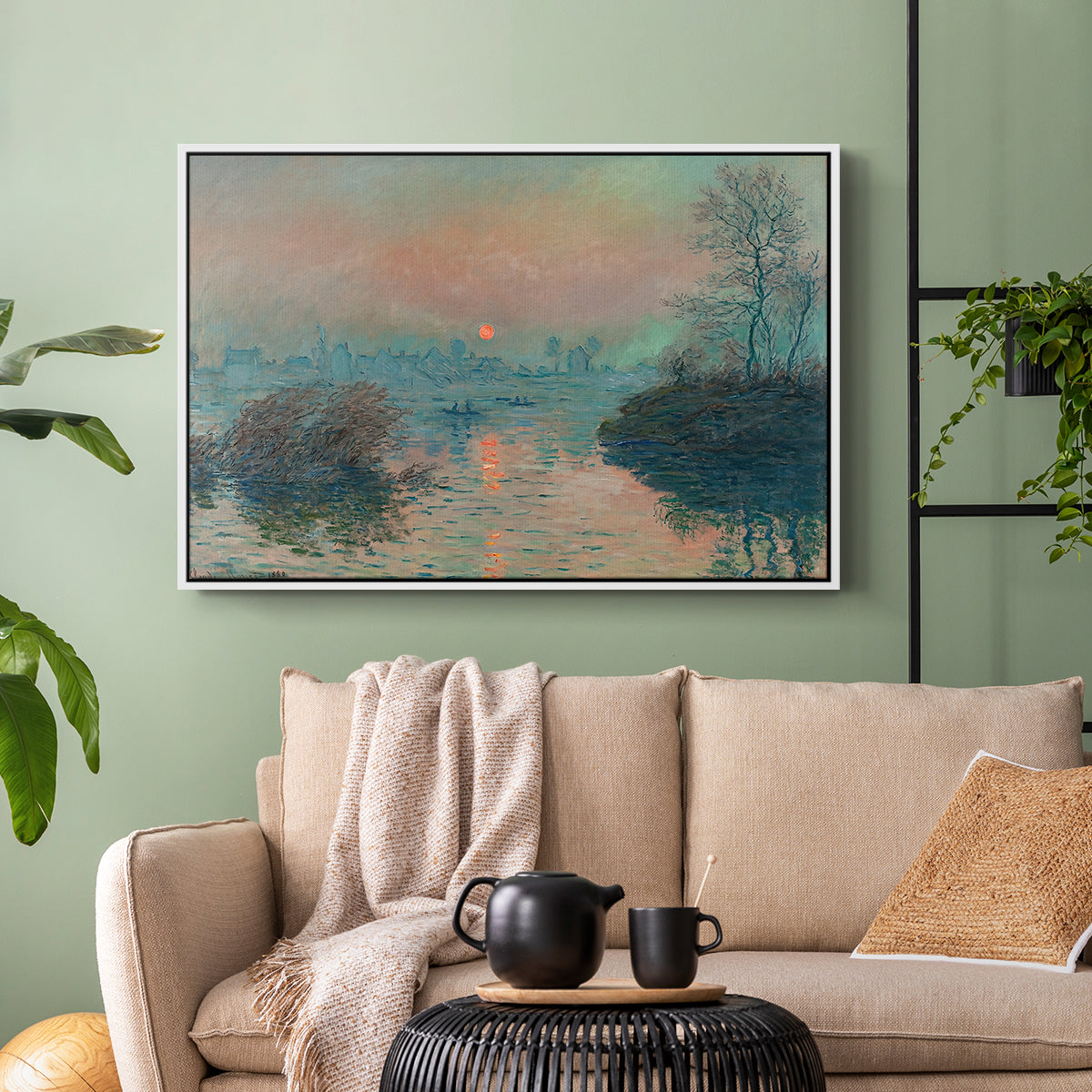 White floater framed canvas featuring an atmospheric landscape combining cold tones and warm sky, displayed above a sofa in a modern living room.