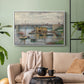 White floater framed canvas featuring a subdued urban landscape with structure spanning river, displayed above a sofa in a modern living room.