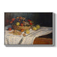 Still Life with Apples and Grapes, 1880 by Claude Monet in a white floater framed canvas wall art display.