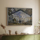 White floater framed canvas of The Gare Saint-Lazare, 1877 by Claude Monet, featuring an impressionist scene of trains and smoke inside busy railway station above a sideboard in a softly lit hallway.