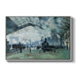 The Saint-Lazare Station, 1877 by Claude Monet in a white floater framed canvas wall art display.