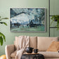 White floater framed canvas featuring a dramatic depiction of industrial space with trains and light, displayed above a sofa in a modern living room.