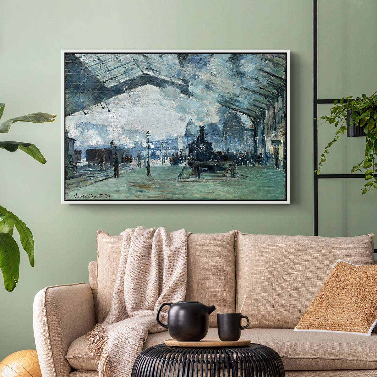 White floater framed canvas featuring a dramatic depiction of industrial space with trains and light, displayed above a sofa in a modern living room.