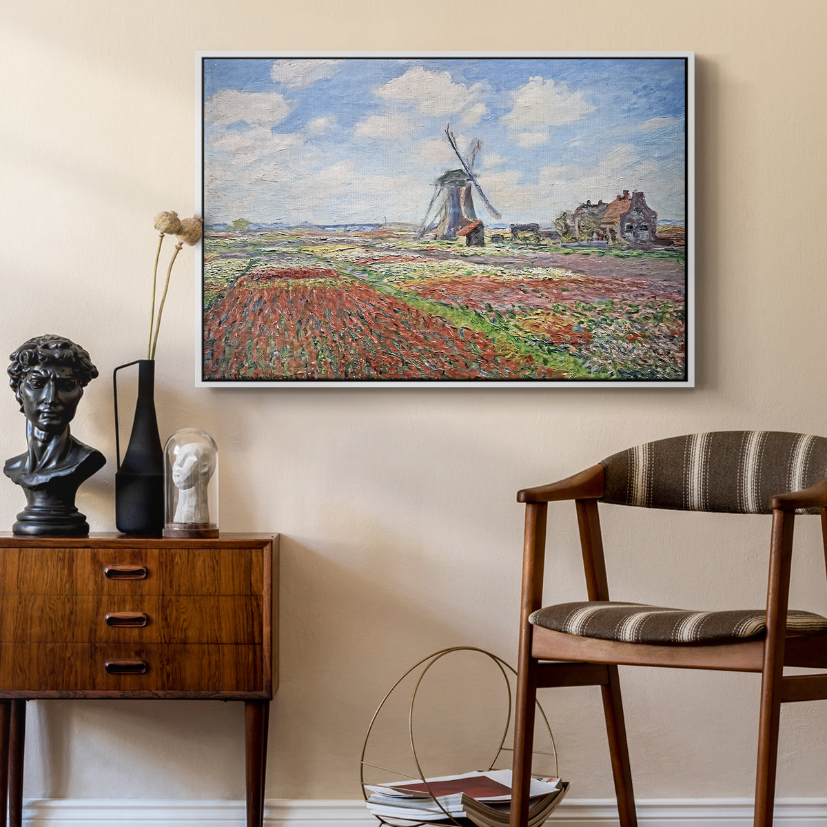 Tulip Fields with the Rijnsburg Windmill, 1886 by Claude Monet as a white floater framed canvas featuring an impressionist field of blooming tulips under bright sky, styled above a mid-century console in a contemporary living area.