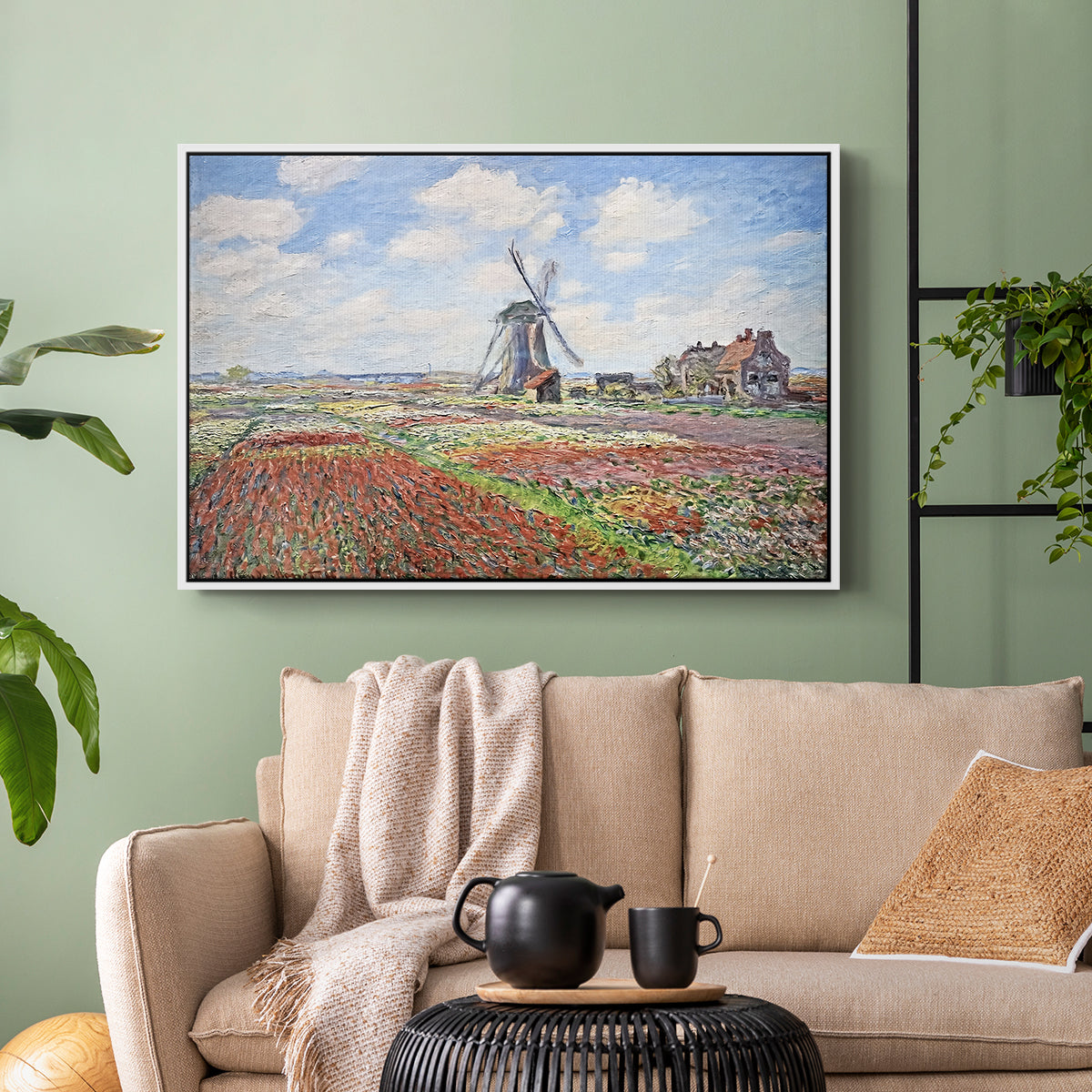 White floater framed canvas featuring a rural scene with patterned rows of flowers and windmill, displayed above a sofa in a modern living room.