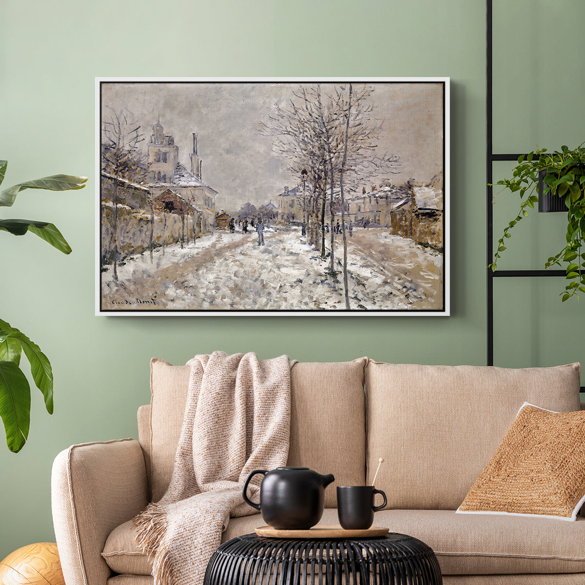 White floater framed canvas featuring an urban winter landscape with muted tones and soft light, displayed above a sofa in a modern living room.