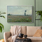 White floater framed canvas featuring a natural field scene with vibrant red flowers, displayed above a sofa in a modern living room.