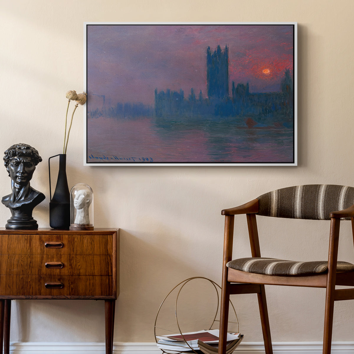 The Houses of Parliament, Sunset, 1903 by Claude Monet as a white floater framed canvas featuring an atmospheric London scene with buildings fading into haze, styled above a mid-century console in a contemporary living area.