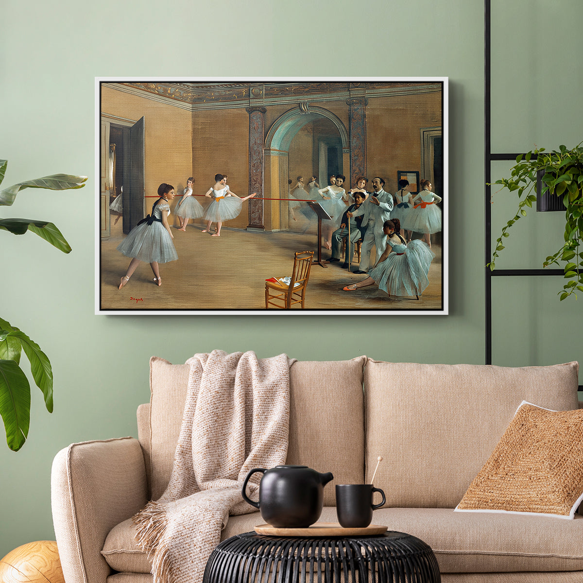 White floater framed canvas featuring an elegant rehearsal space with dancers in soft lighting, displayed above a sofa in a modern living room.