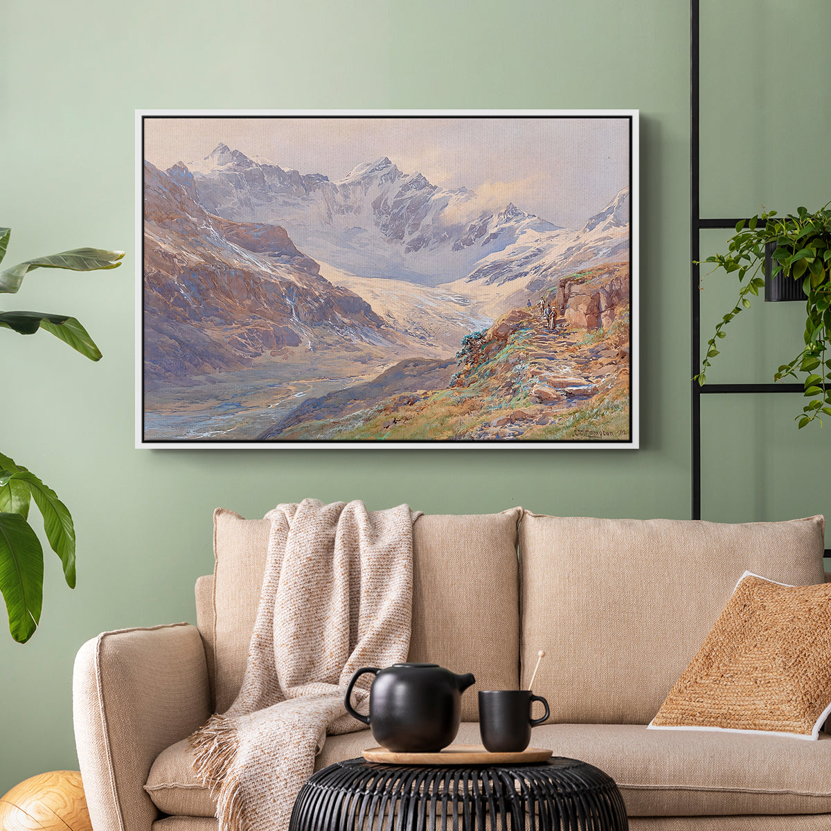 White floater framed canvas featuring an expansive alpine view with ice and distant mountains, displayed above a sofa in a modern living room.