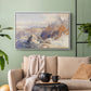 White floater framed canvas featuring a rugged mountain pass scene with distant peaks, displayed above a sofa in a modern living room.