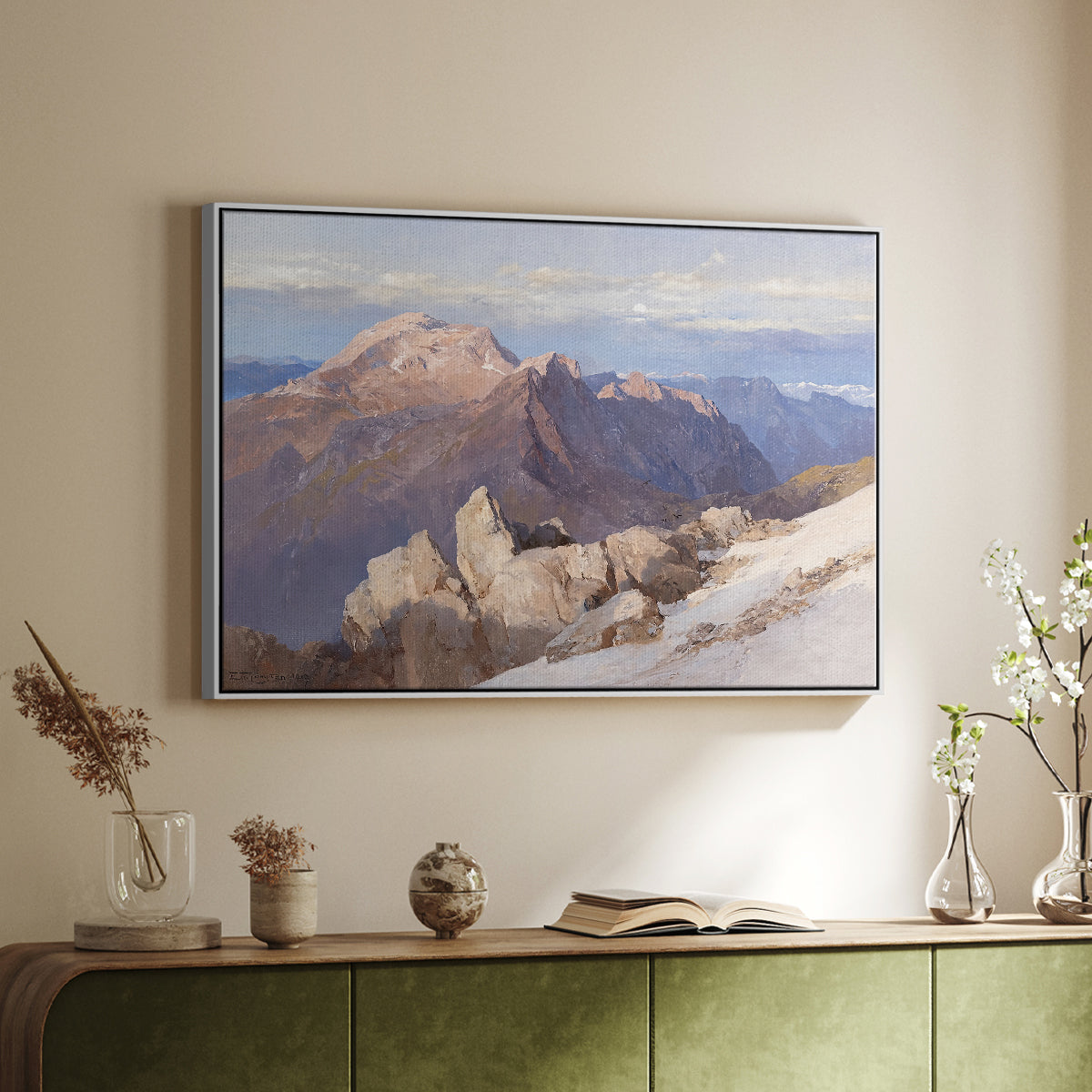 White floater framed canvas of Hoher Göll from Watzmann-Hocheck, 1919 by Edward Theodore Compton, featuring an alpine panorama showing layered peaks and valleys above a sideboard in a softly lit hallway.