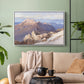 White floater framed canvas featuring an expansive mountainous landscape with natural depth, displayed above a sofa in a modern living room.