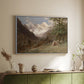 White floater framed canvas of Landscape in the Caucasus, c. 1921 by Edward Theodore Compton, featuring an expansive view of Caucasus mountains under open sky above a sideboard in a softly lit hallway.