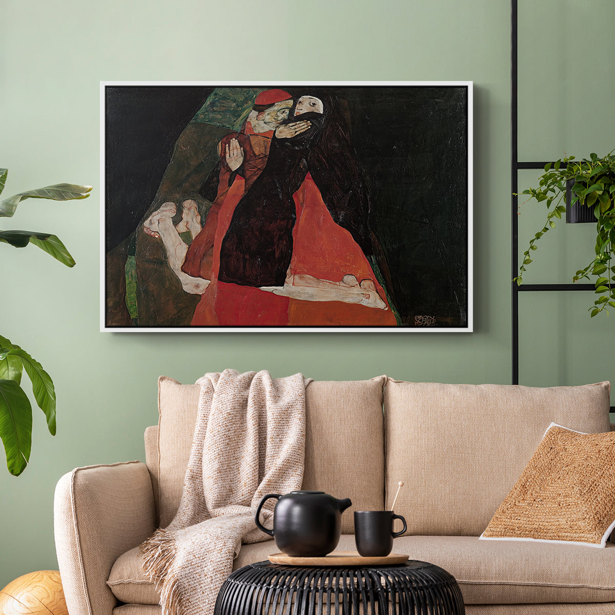 White floater framed canvas featuring an intimate scene with religious figures in modernist style, displayed above a sofa in a modern living room.