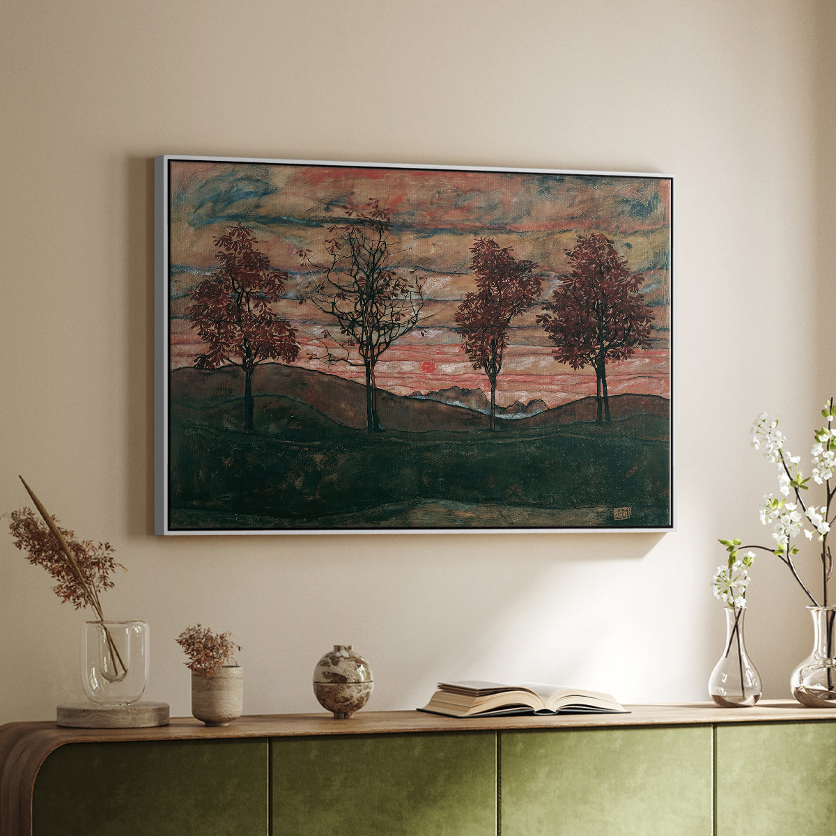 White floater framed canvas of Four Trees, 1917 by Egon Schiele, featuring a minimal landscape with grouped trees and expressive color above a sideboard in a softly lit hallway.