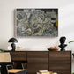 Mödling II, 1918 by Egon Schiele displayed in a white floater framed canvas above a dark wood credenza in an entryway.