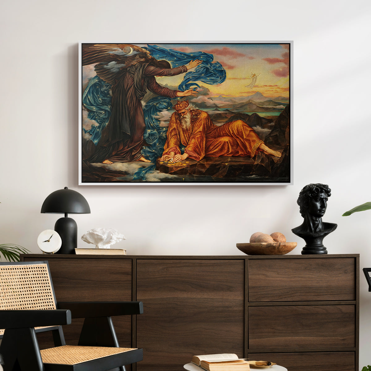 Earthbound, 1897 by Evelyn De Morgan displayed in a white floater framed canvas above a dark wood credenza in an entryway.